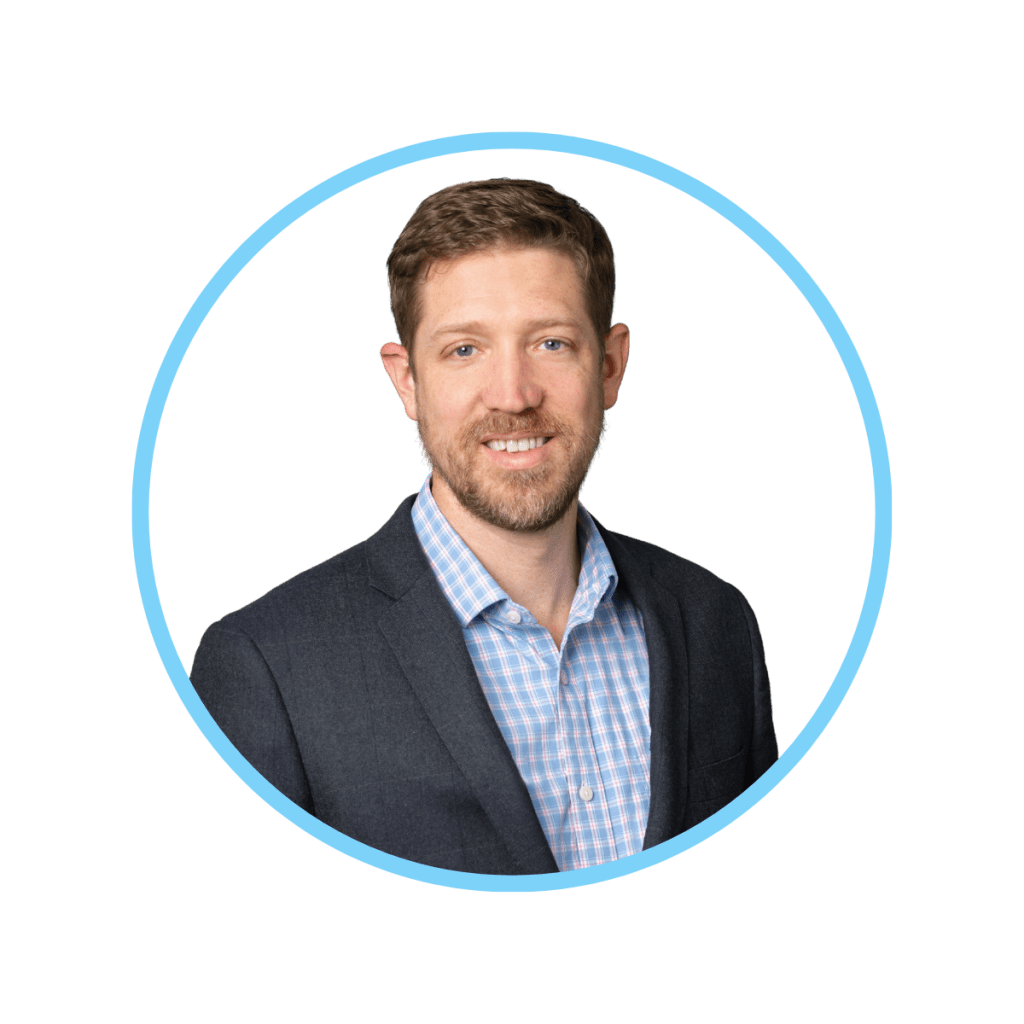 Alex Dews in a suit, no tie